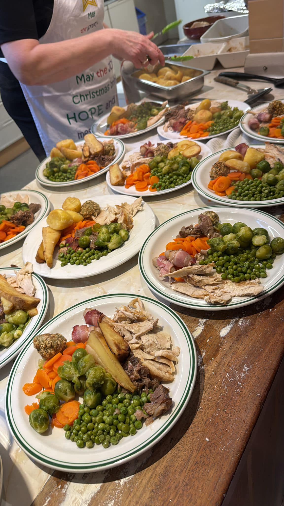 Volunteers serving food to guests